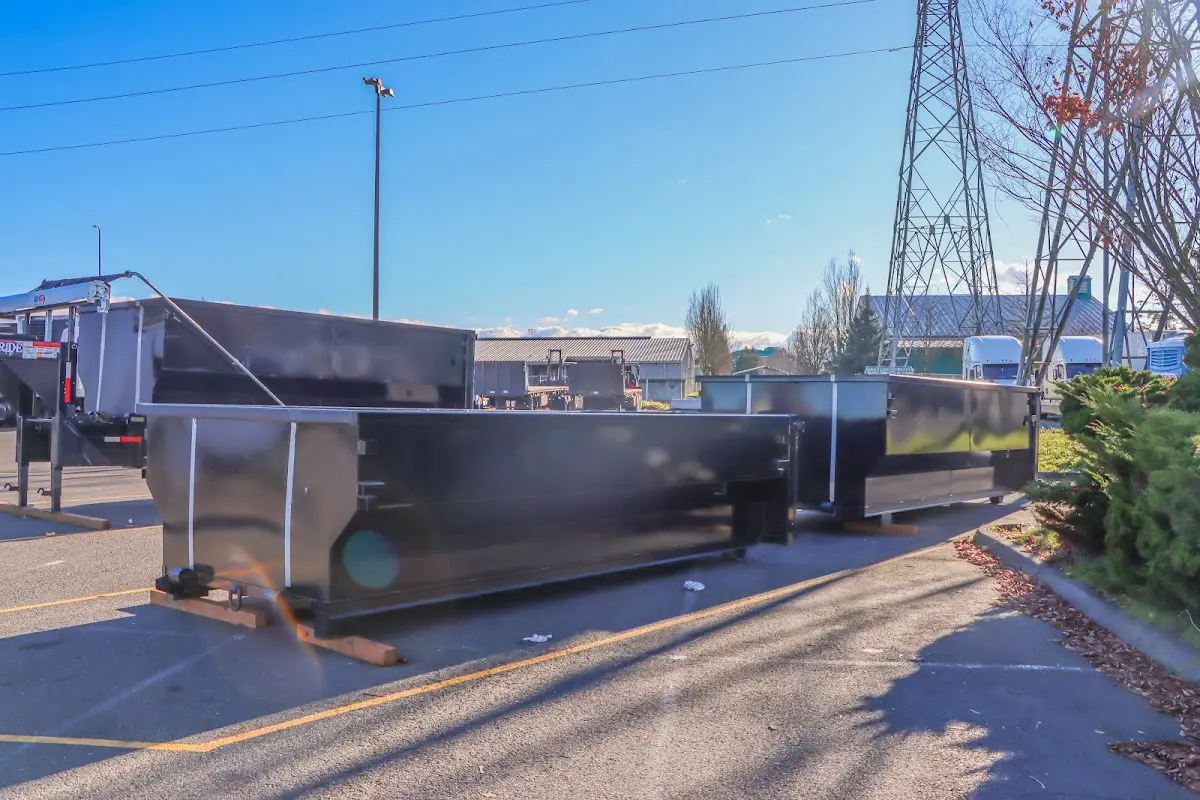 Roll-off dumpster ready for waste disposal at job site for Yard Waste Dumpster Rental in Charleston